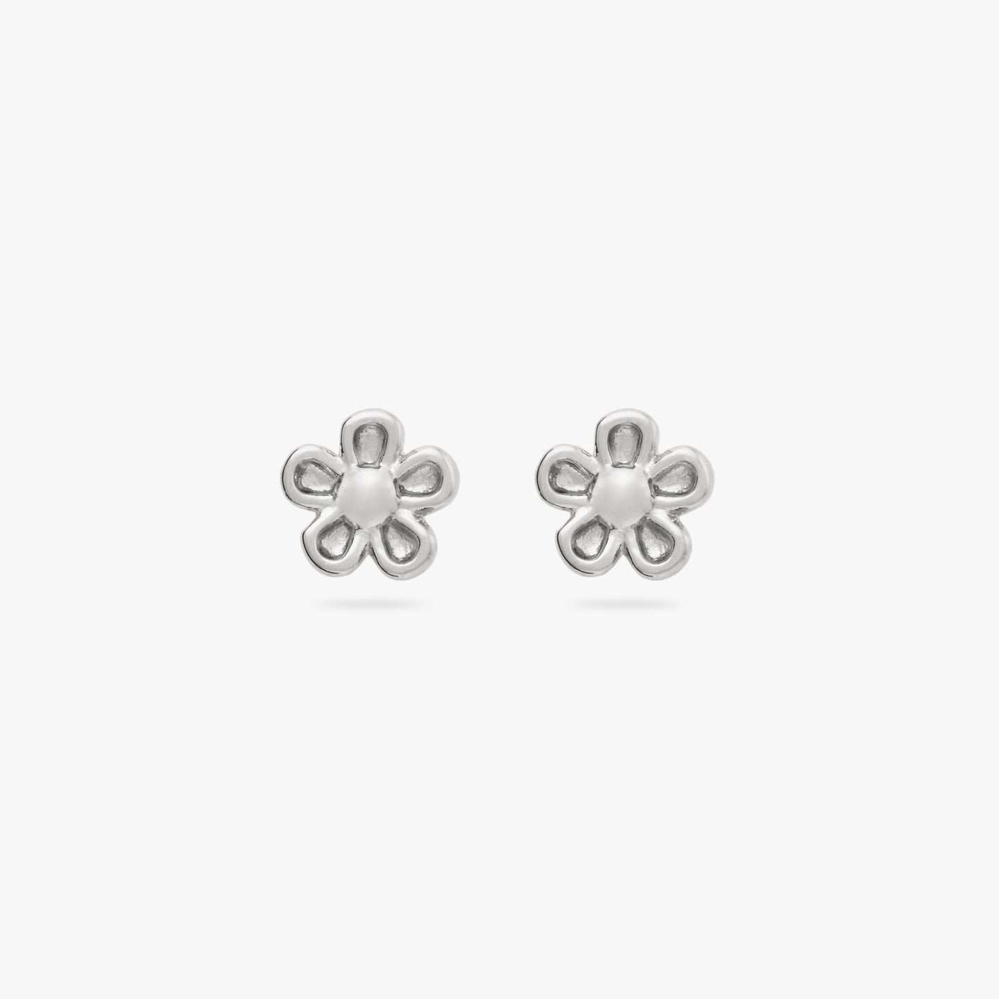 This is a pair of small silver daisy studs [pair] color:null|silver