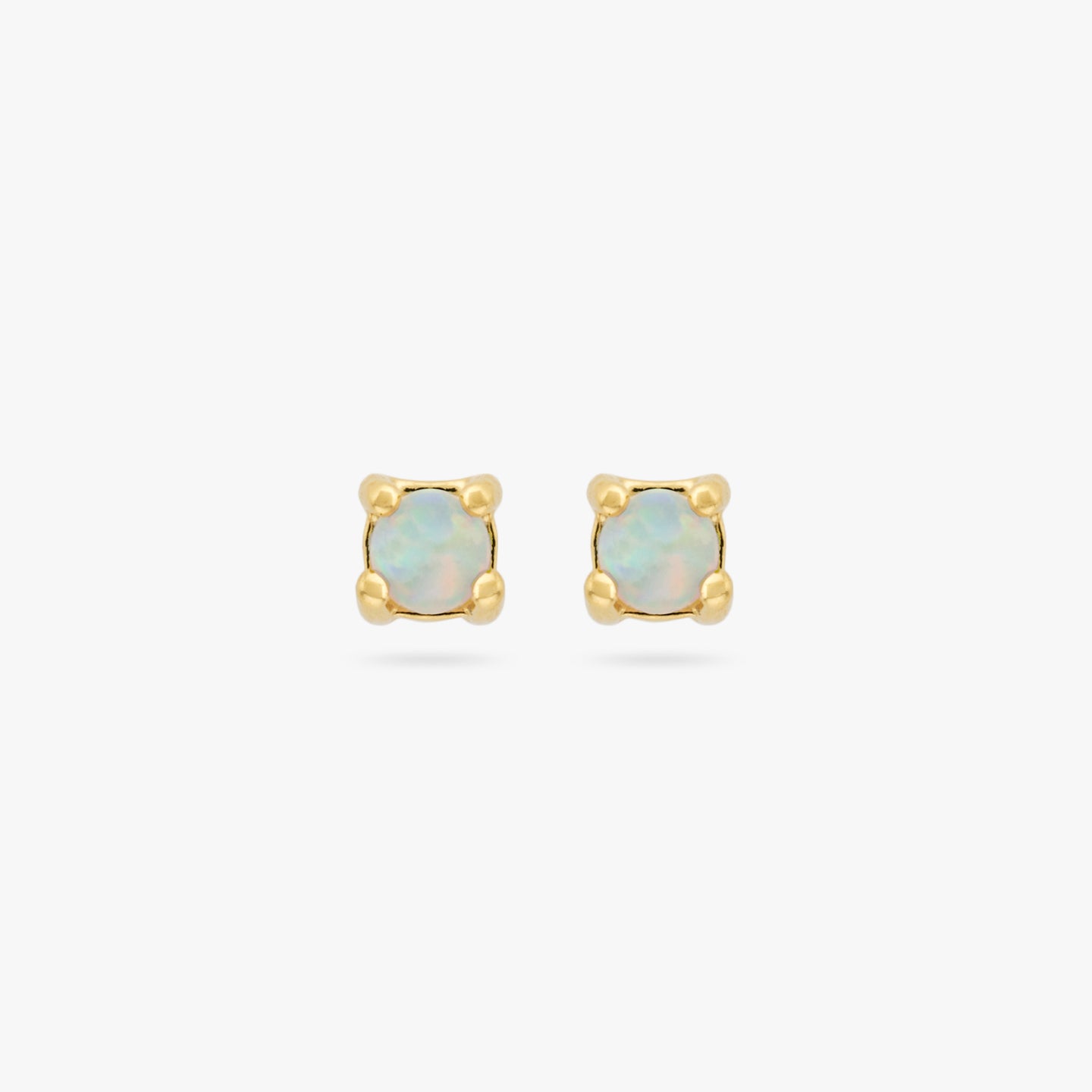 This is a pair of small gold studs with an opal [pair] color:null|gold/opal
