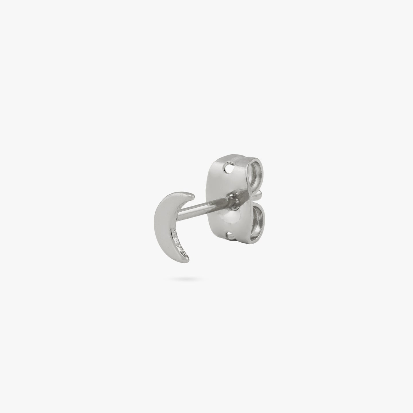 A silver small moon shaped stud color:null|silver