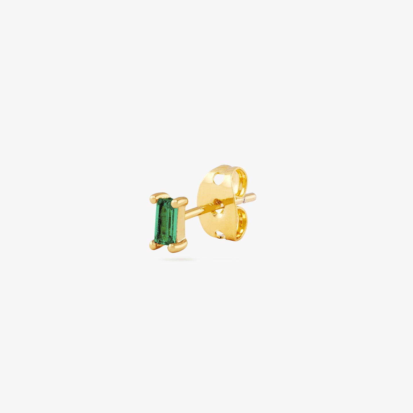 This is a gold baguette stud with a green CZ gem color:null|gold/green
