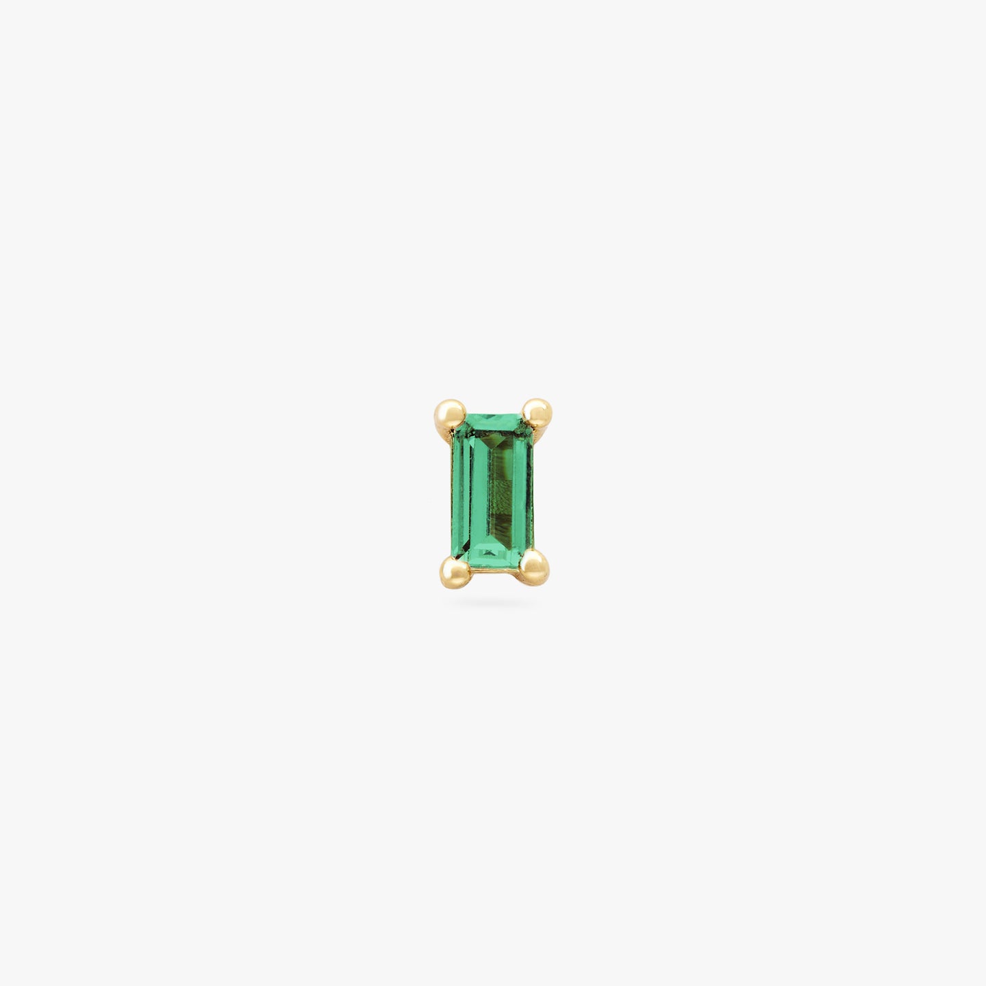 This is a gold baguette stud with a green CZ gem color:null|gold/green