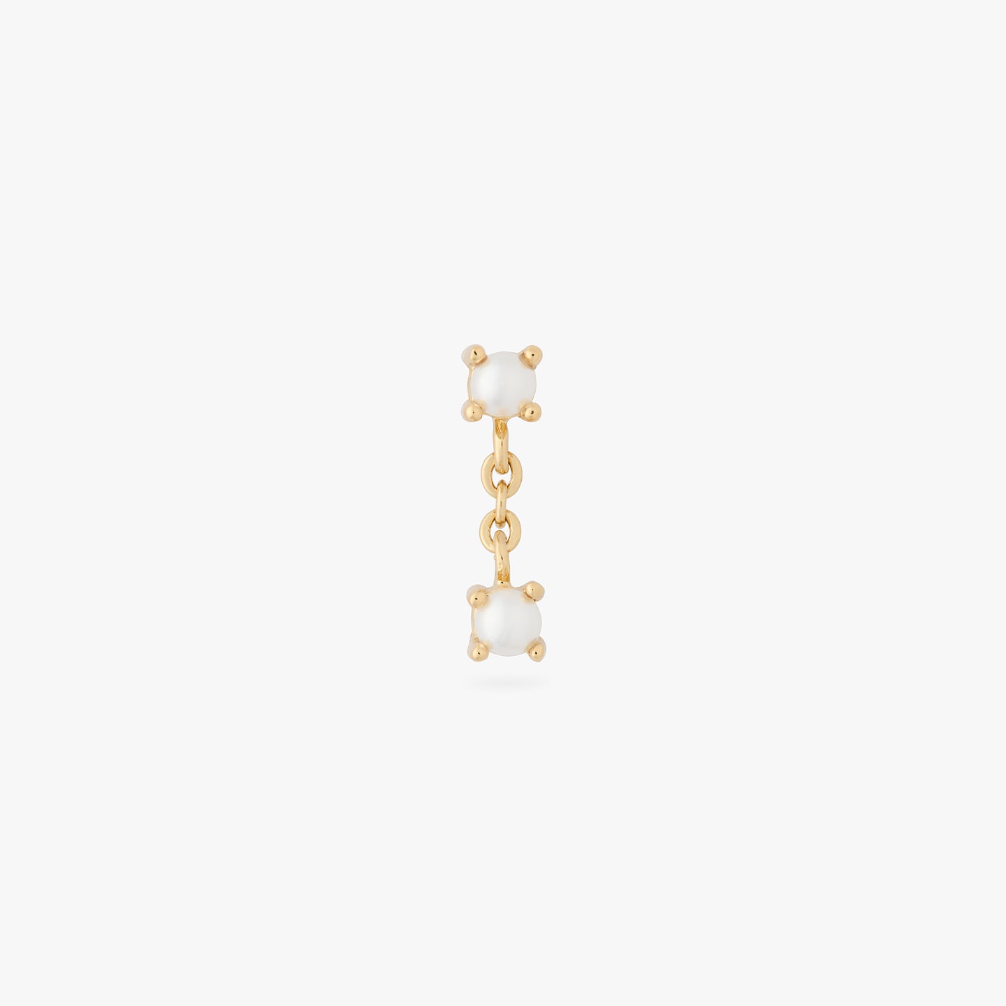 a gold pearl stud with a gold chain connecting it to another pearl color:null|gold