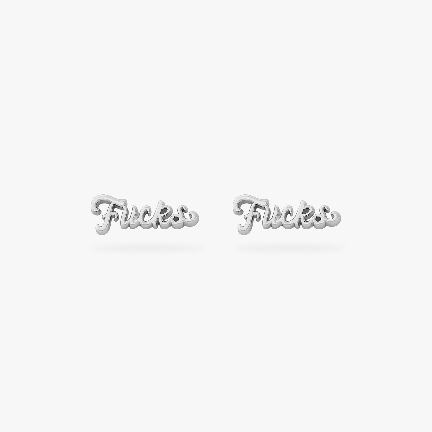 a pair of silver studs that spell out fucks in cursive writing [pair] color:null|silver