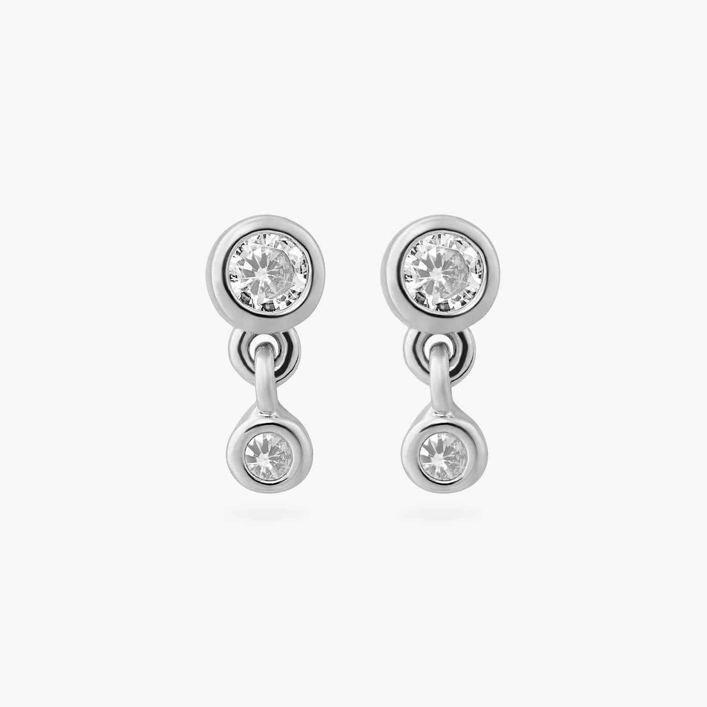 a pair of silver plated bezel studs with clear cz and another clear bezel cz hanging from them [pair] color:null|silver/clear