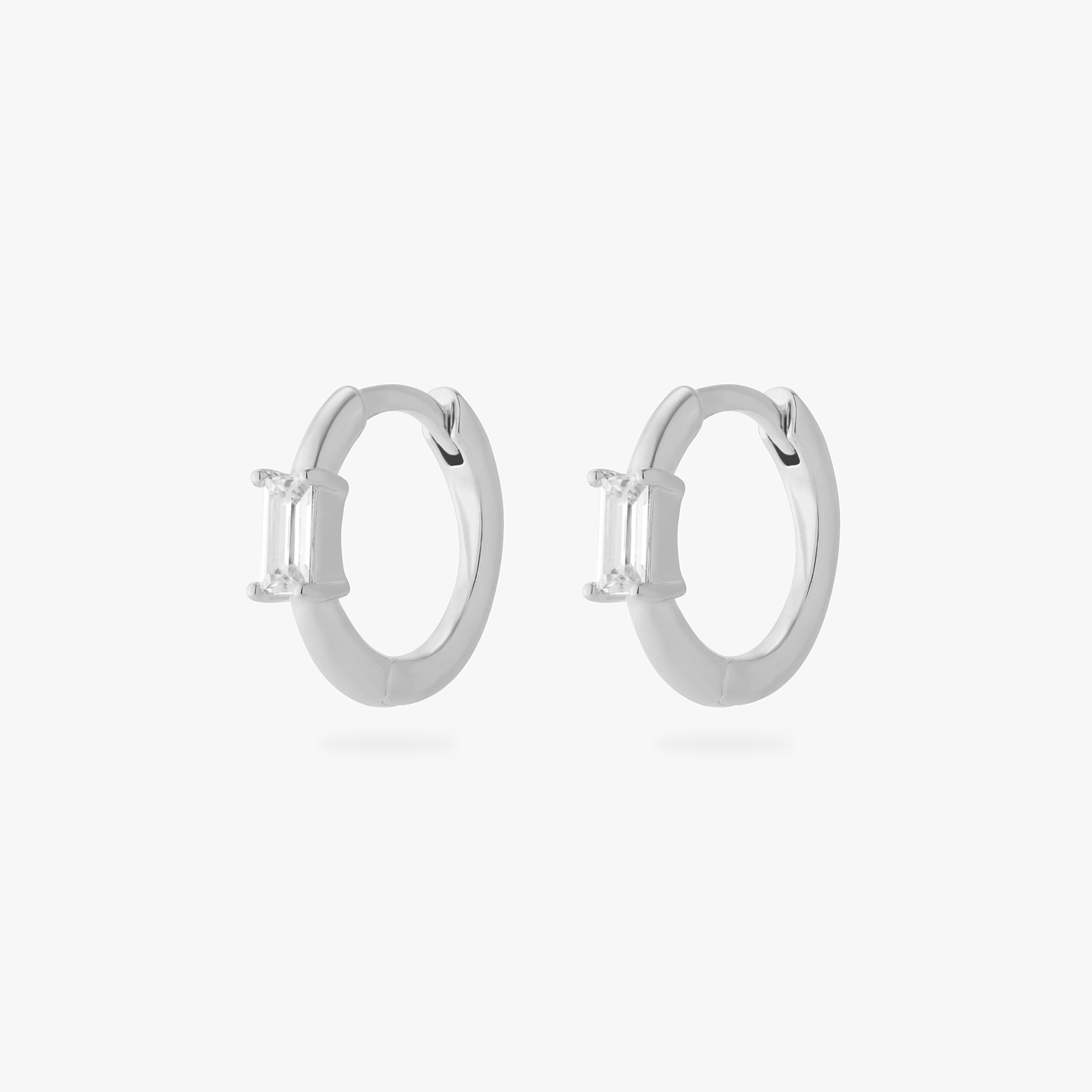 a pair of silver slim huggies with clear baguette shaped CZs [pair] color:null|silver/clear