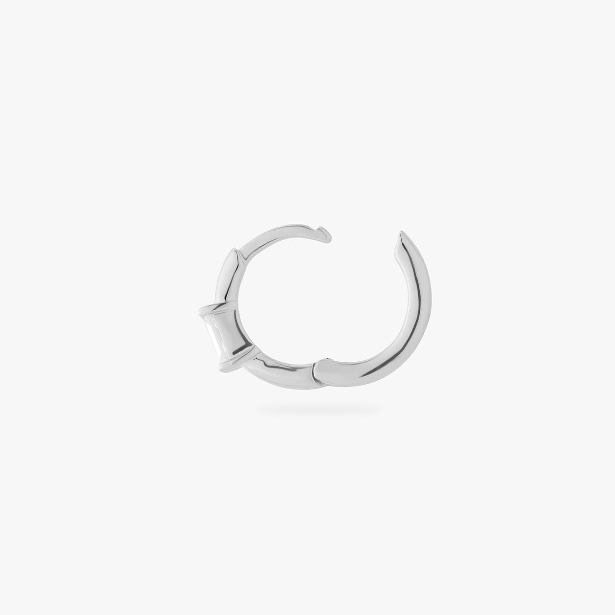a silver small slim huggie with a clear baguette cz color:null|silver/clear