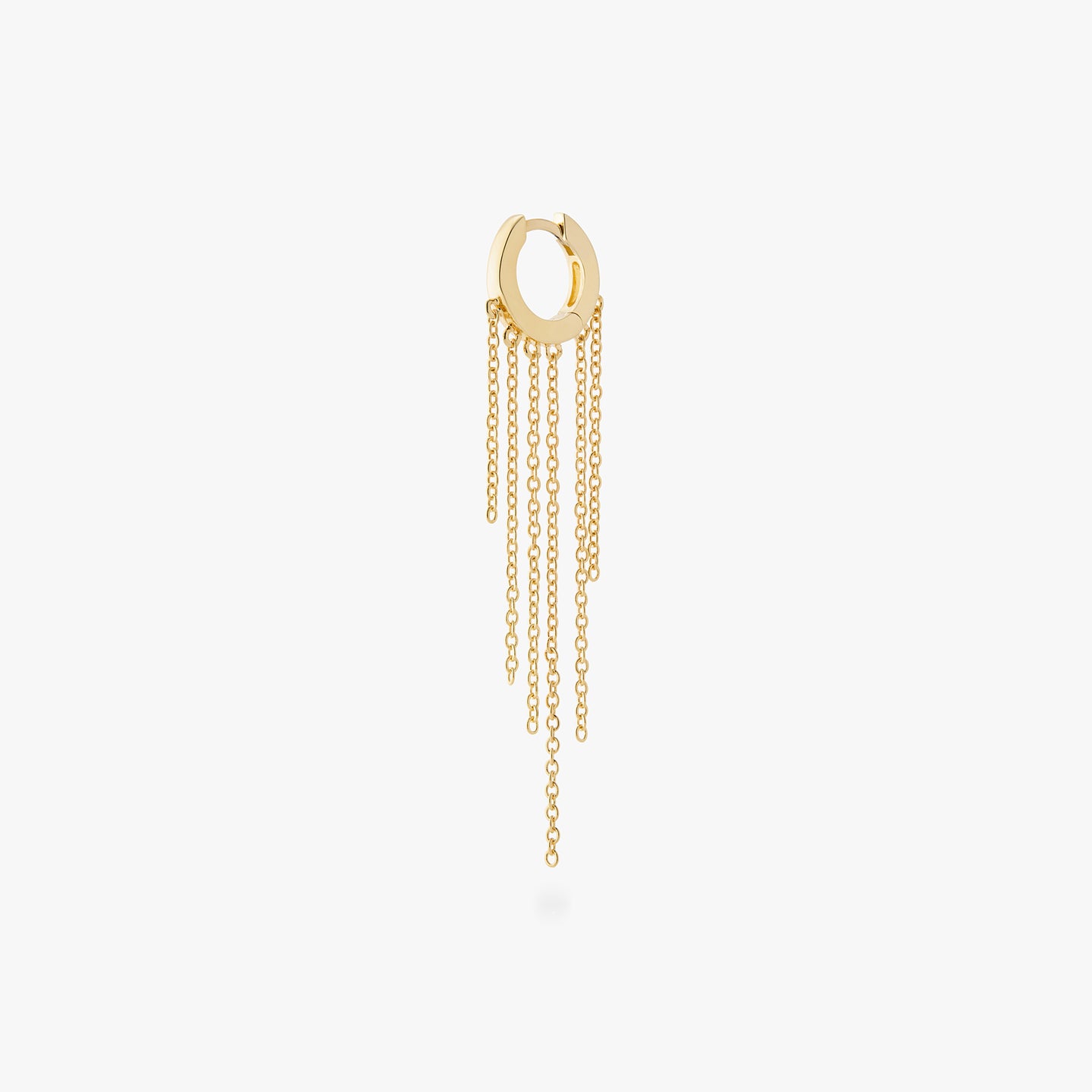 a gold huggie with long gold fringed chain hanging from it color:null|gold