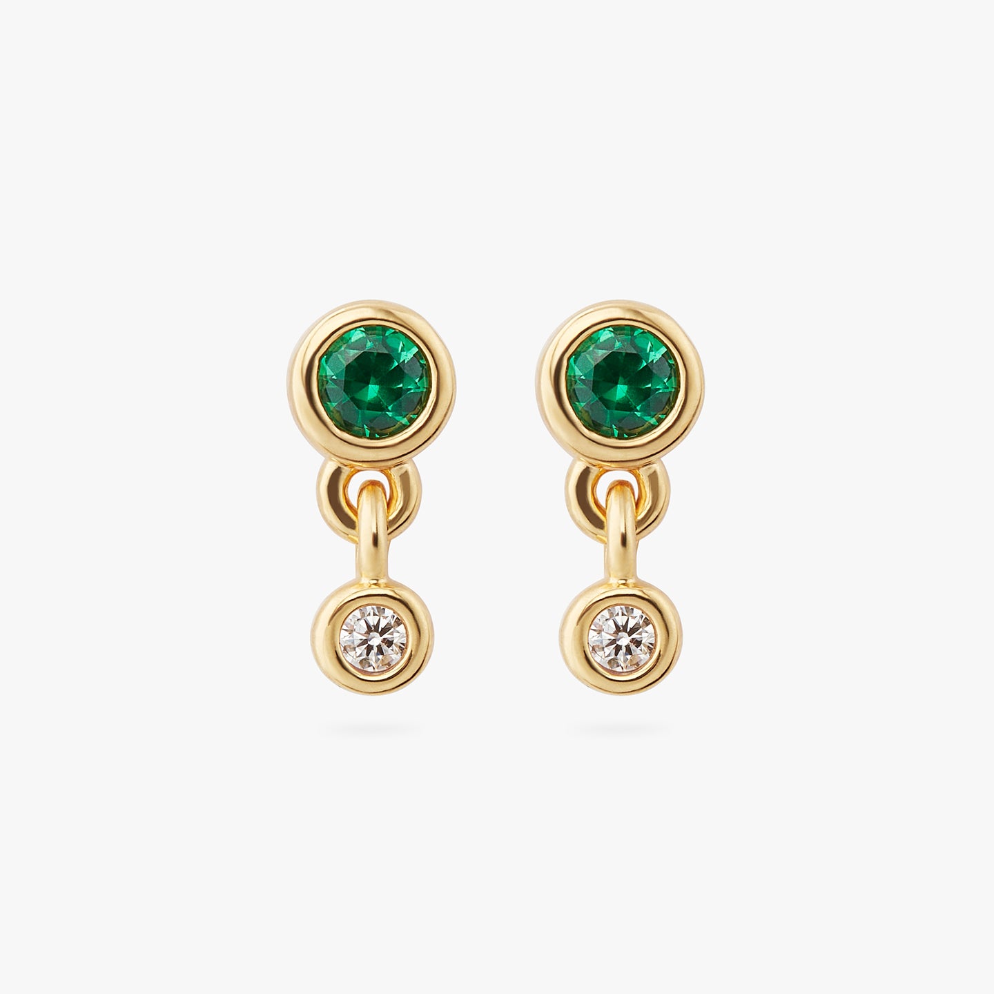 a pair of gold plated bezel studs with green cz and another clear bezel cz hanging from them [pair] color:null|gold/green