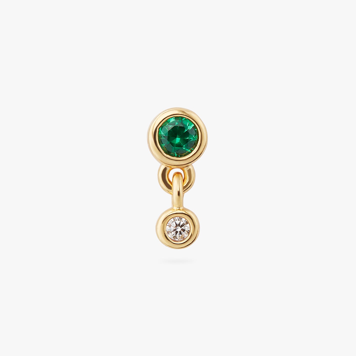 a gold plated bezel stud with a green cz and another clear bezel cz hanging from it color:null|gold/green