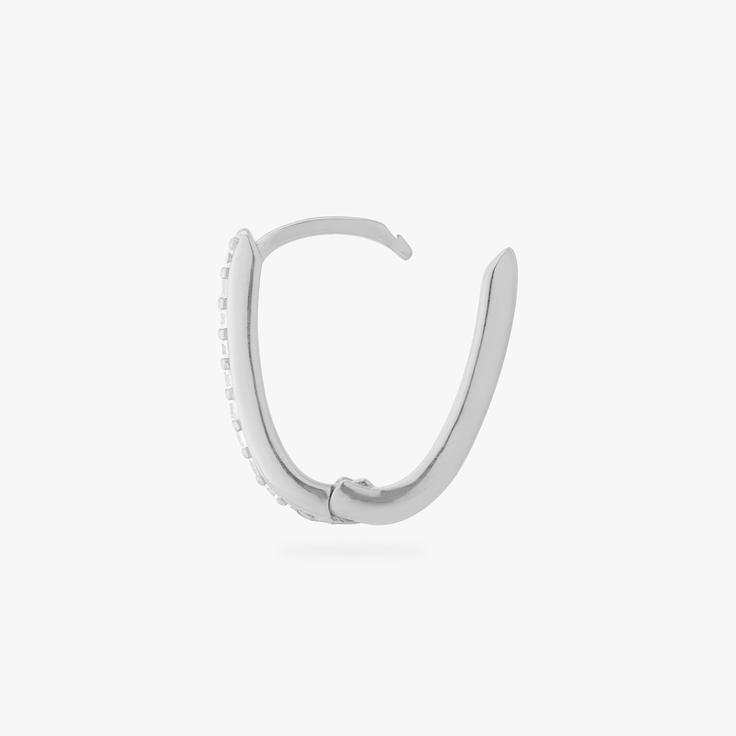 a silver medium oval hoop that has one side pave color:null|silver/clear