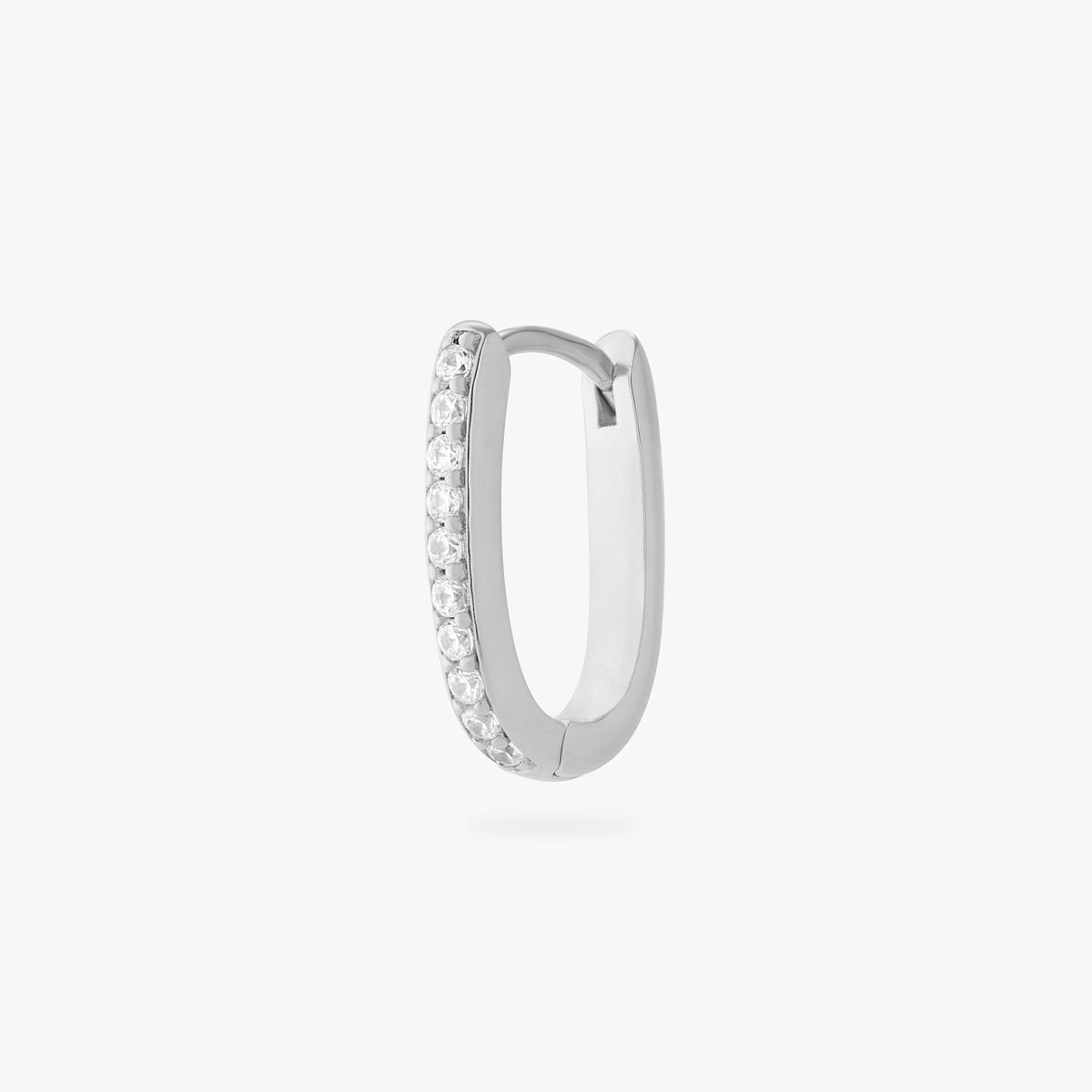 a silver medium oval hoop that has one side pave - Main view