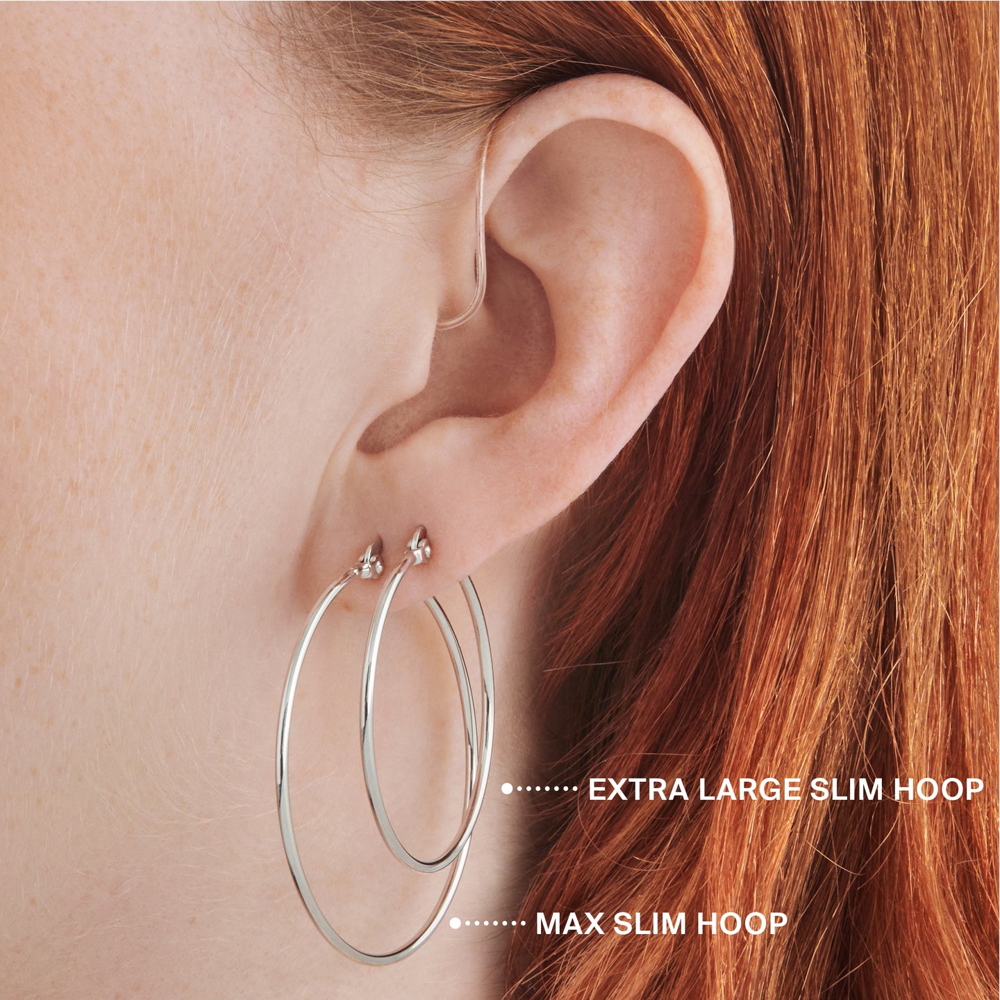 an extra large slim hoop in silver on ear [hover] color:null|silver